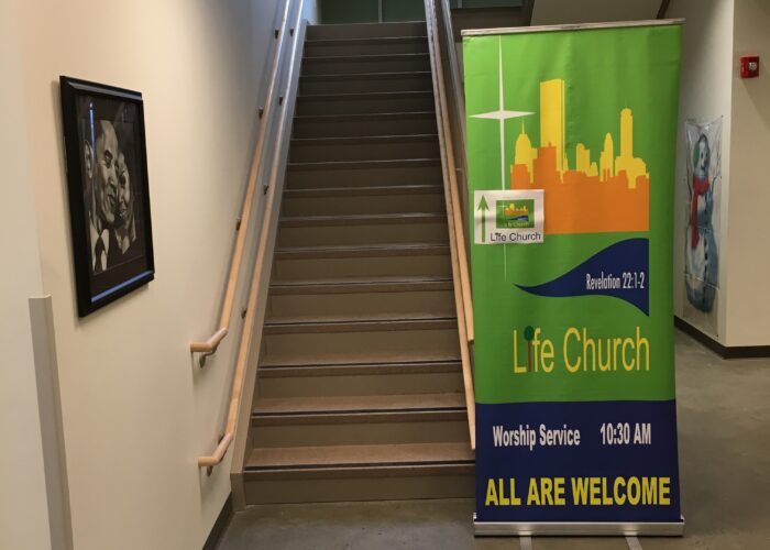 Life Church Boston banner next to a staircase